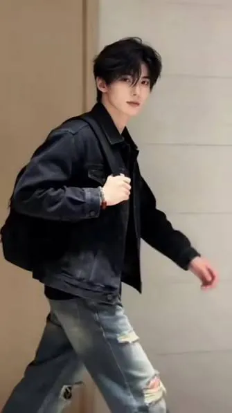 A teenager wearing black clothes