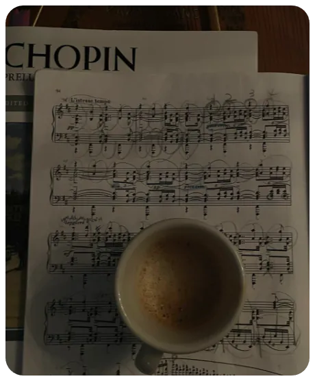 chopin sheet music with a coffee cup on it.