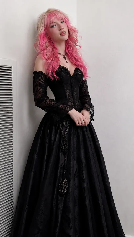 Alicia is wearing a black ball dress