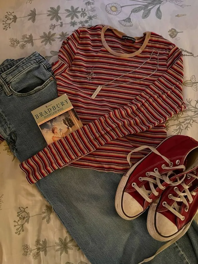 Red long sleeve and converse along with jeans