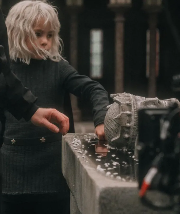 young boy looks at helmet