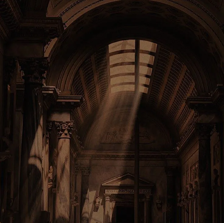 a brown archway with light streaming in from one side
