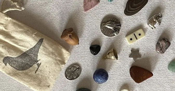 Small white pouch with trinkets