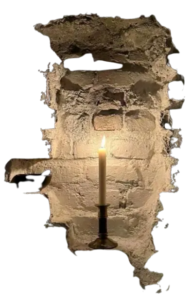 a lit candle, in a small alcove